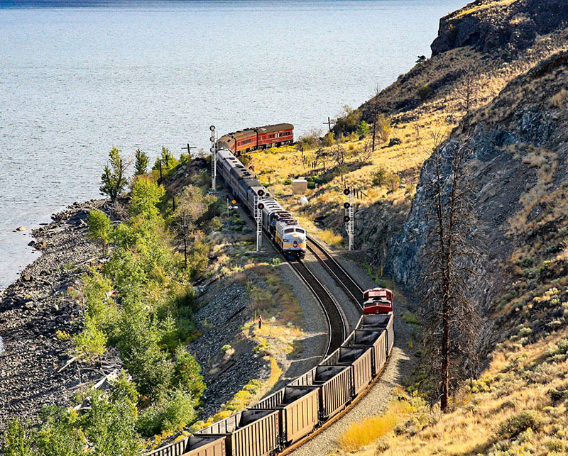 On capacity improvements made under Bill Salmond's watch; a westbound Royal Canadian Pacific business train meets an eastbound coal empty train destined for the southern BC coal mines. Photo by John Leeming.