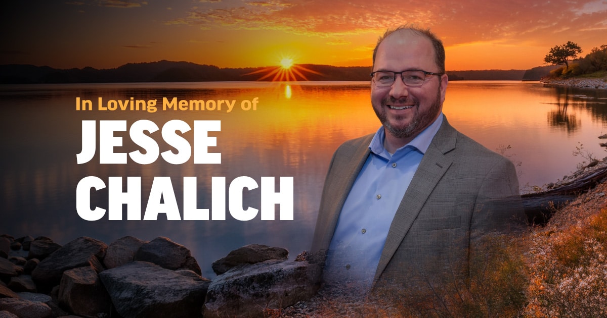 Photo of Jesse Chalich Memorial with the background looking over a lake during sunset.
