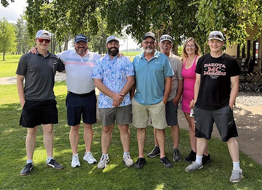 Last year’s tournament with Jesse (second from left) presents a happy pose with a group of NPR’s finest golfers.
