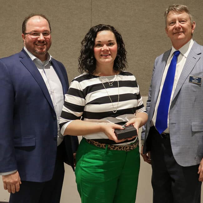 Jesse and Chairman Gregg F. Haug have the pleasure of presenting Julie Chalich with her 20-year service award at the Northern Plains annual employee meeting and dinner.