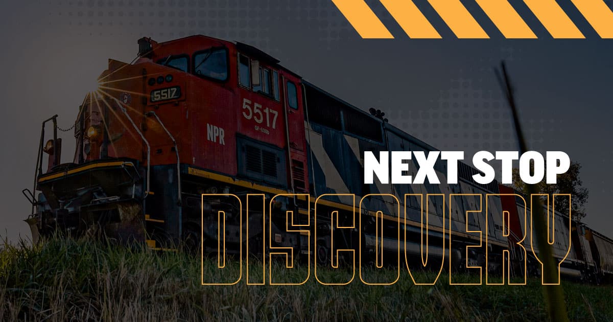 The words, "Next Stop Discovery" with a train in the background.